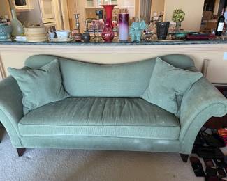 $80 Uniquely shaped rolled arm sofa. 89"w X 39"d X 36"h. (as found)