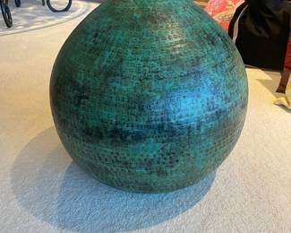 $60 Patinaed metal vase. Approximately 23"h X 18" dia.