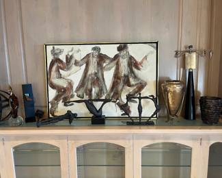 Another view of "Three Rabbis Dancing" shown with other decorative pieces available for in-person shopping Friday and Saturday.