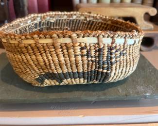 $240 Walter Ward of the Hoh tribe hand woven tribal basket depicting elk, mask, butterfly and bear. 8"w X 6"d X 3.5"h