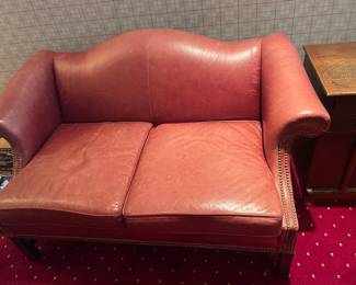 $240 Red leather loveseat. 58"w X 32"d X 33"h.