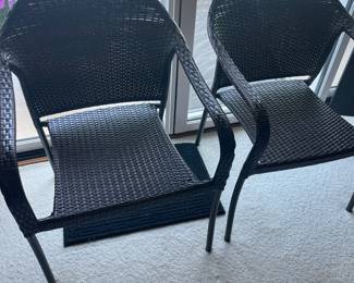$40 Set of two outdoor wicker stacking chairs. 24"w X 27"d X 35"h.