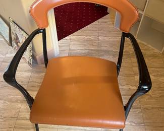 $60 One of four of a set of leather and molded plastic stacking chairs.