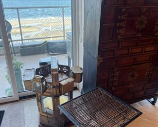 Folding side table shown with brass Thai Noodle Cart.