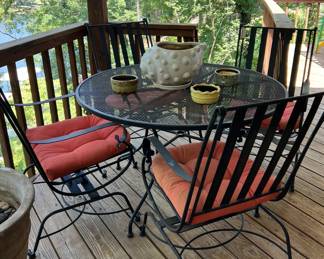 Wrought Iron patio table with 4 rocker chairs