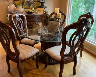Round glass top table with 5 matching chairs