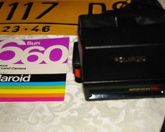 Vintage polaroid camera with instruction guide