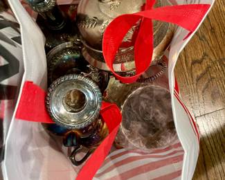 Lots of silver plated items that are beautiful and ready for a fantastic party