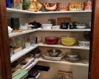 many clean vintage bowls, molds, bakeware