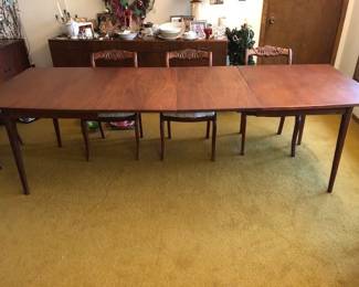 MCM dining table solid walnut. 2 leaves 20" each. Overall length can be 8' 4" x 38" Beautiful condition