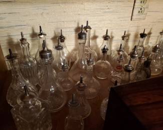 A wide collection of cruets, perfume bottles and bitters.