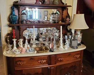 25 % Off Sunday! This carved, marble-top sideboard with mirror provides plenty of deep storage at the bottom.