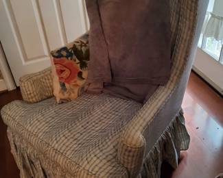 Lovely high-back swivel chair with skirt.