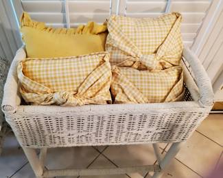 Put throws, pillows, a baby in this piece of wicker.