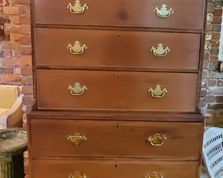 The Chest of Drawers will fool you! Pull out one drawer and you have a secretary.