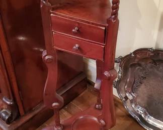 Beautiful piece and adds taste to any room. Cute fern stand with two drawers and a shelf.