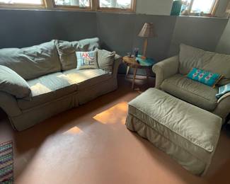 Beige, neutral-covered  loveseat, chair and ottoman 