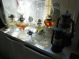 Lots of antique oil lamps