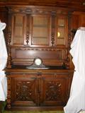 This is a huge black walnut hutch. It is intricately carved. Really hard to get a picture that does it justice.