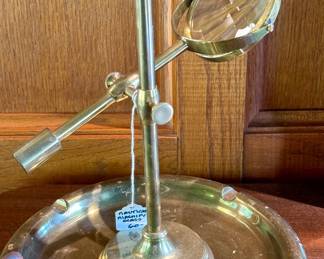 $60; brass nautical magnifying glass; 10x10.   $38; brass and wood ashtray; 11dx3h