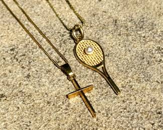 $100; cross pendant on 14K gold chain.    $170; tennis racquet and ball on 14K gold chain.