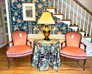 $200; authentic mid-century modern table; 30x28.     $100; custom floral cloth for 30” table.    $300 each (2 available); custom upholstered velvet French provincial chairs by Colony House; 27x21x38.    $300; brass urn table lamp with dragon head handles; 21x32.     $150; Harper’s Weekly framed print; 18x24.
