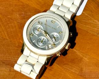 $32; Michael Kohrs white and gold watch