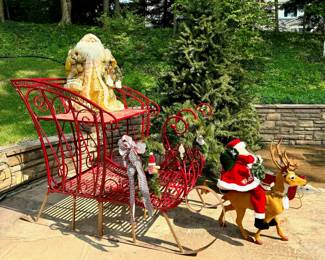 $350; red and gold metal sleigh with top seat and bottom basket area (as is—one scroll at the front of the sleigh is off); 36x64x48.      $100; artificial Christmas tree with stand; 4’x7.5’.    $50; gold Santa (as is); 34”h.    $80; gingerbread man plaid garland; 8’.     $80; Santa riding reindeer; 3’h