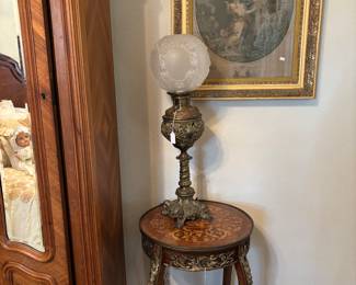 Inlaid French side table with beautiful lamp. 