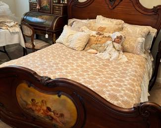 Louis XV French highly carved walnut bed, painting on footboard.