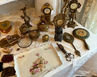 Small French clocks, dresser items, candle snuffer. 
