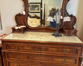 Stunning walnut dresser, highly carved, beveled mirror.