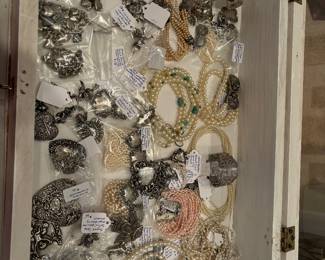 Lots of T Foree Hunsicker jewelry and Miriam Haskell.  Lots of sterling silver jewelry. 