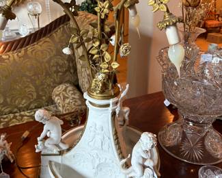 Serves France Centerpiece lamp with three cherubs on dolphins, 4 lights entwined with gold ormolu leaves and porcelain roses, center light with frosted light flame shade with mark and signature of designer. Circa 1880