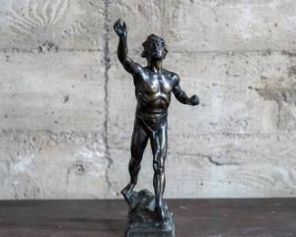 "The Messenger of Marathon" a bronze sculpture by artist Ed. Lachmann. The piece depicts the famous historical story of the runner who delivered the message of the victory of the Battle of Marathon. There is a holder under the runner's hand to insert a paper scroll. The piece is signed by the artist on the base.