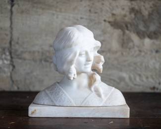 A carved alabaster bust depicting the head and shoulders of a young woman. Originating form the Italian school, circa late 19th/early 20th Century. Set on a rectangular alabaster base.