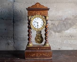 French Empire mantle clock with Rosewood barley twist columns. In need of repair or restoration, but appears to be complete. Movement is signed on back, "Challamel Paris & Dupupet".