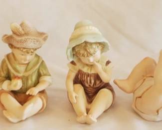 672 - 4 Piano Baby Figurines
