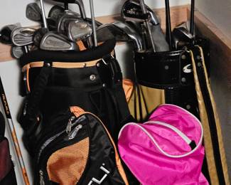 Three sets of golf clubs