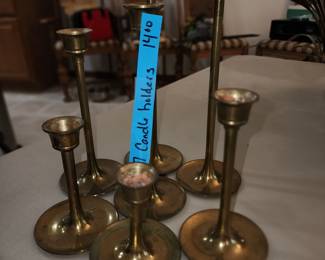 Set of 7 brass candle sticks