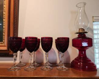 Crystal red glasses and oil lamp