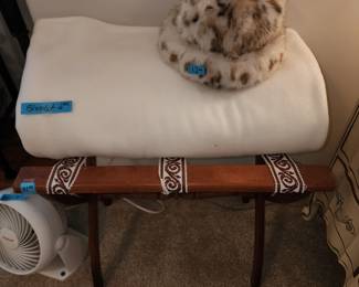 Suitcase stand, blanket and a hat