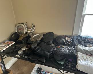 This ENTIRE table is filled with Harley Davidson items! Clothes, Parts, Accessories!
