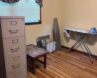 File cabinet and tables, ironing board, iron, mirror