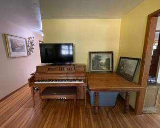 Piano, table, TV, pictures