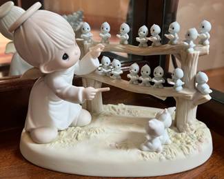 Just a few of the Precious Moments figurines from a large collection