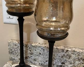 Metal and glass votive candlesticks