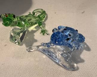 Close-up of lizard and frog figurines