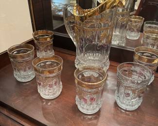 Gold rim with cherry stems pitcher and glasses