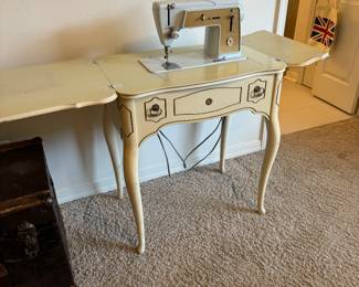 Antique Singer sewing machine with attachments 